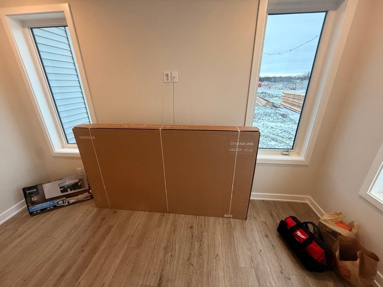 85" TV wall-mount & cable setup — before